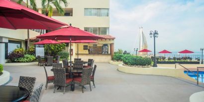 Outdoor seating and coworking space at Hotel Delfin PV Beach Resort.