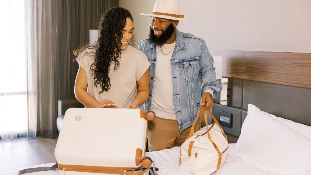 couple unpacking luggage