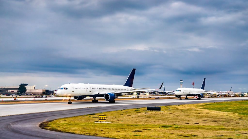 planes lined up on the runway at Atlanta International airport