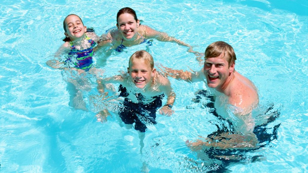 family in swimming pool