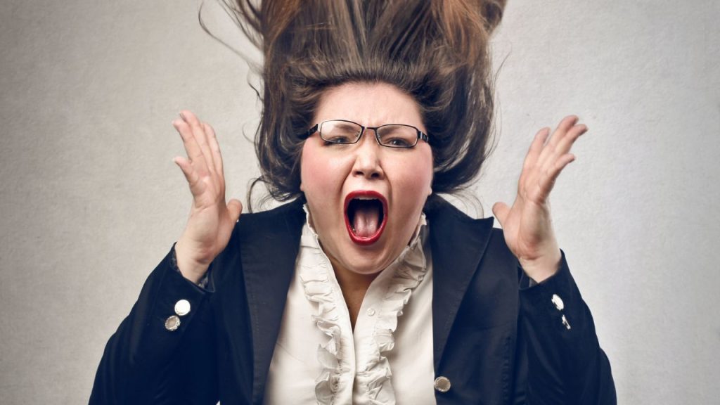 combatting stress and sleeplessness: woman looking fed up with hands up