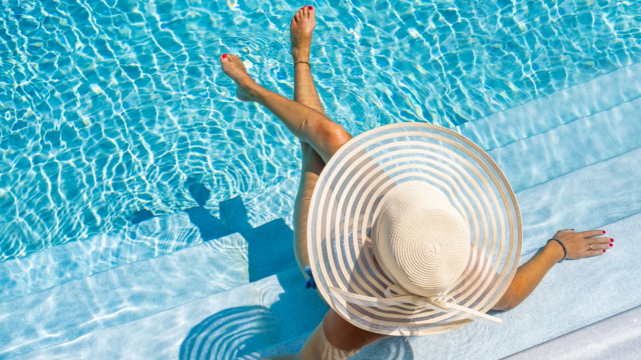 is hotelsbyday legit: woman in luxury resort pool