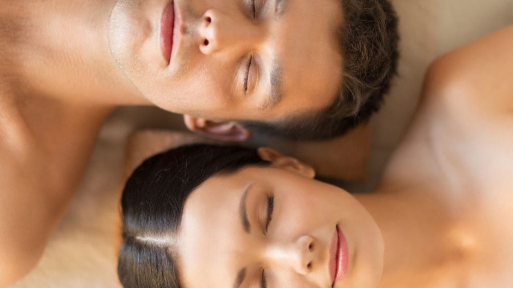 couples massage: close-up of a man a woman lying on massge table