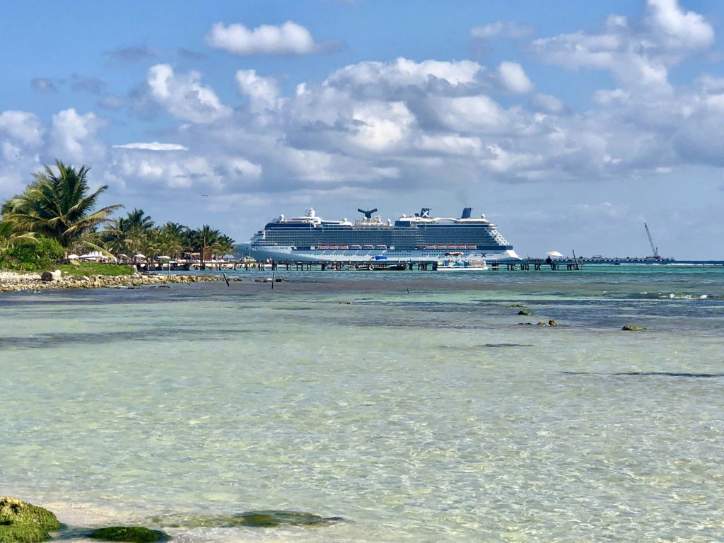 cruise ship at mexican destination with crystal clear ocean water
