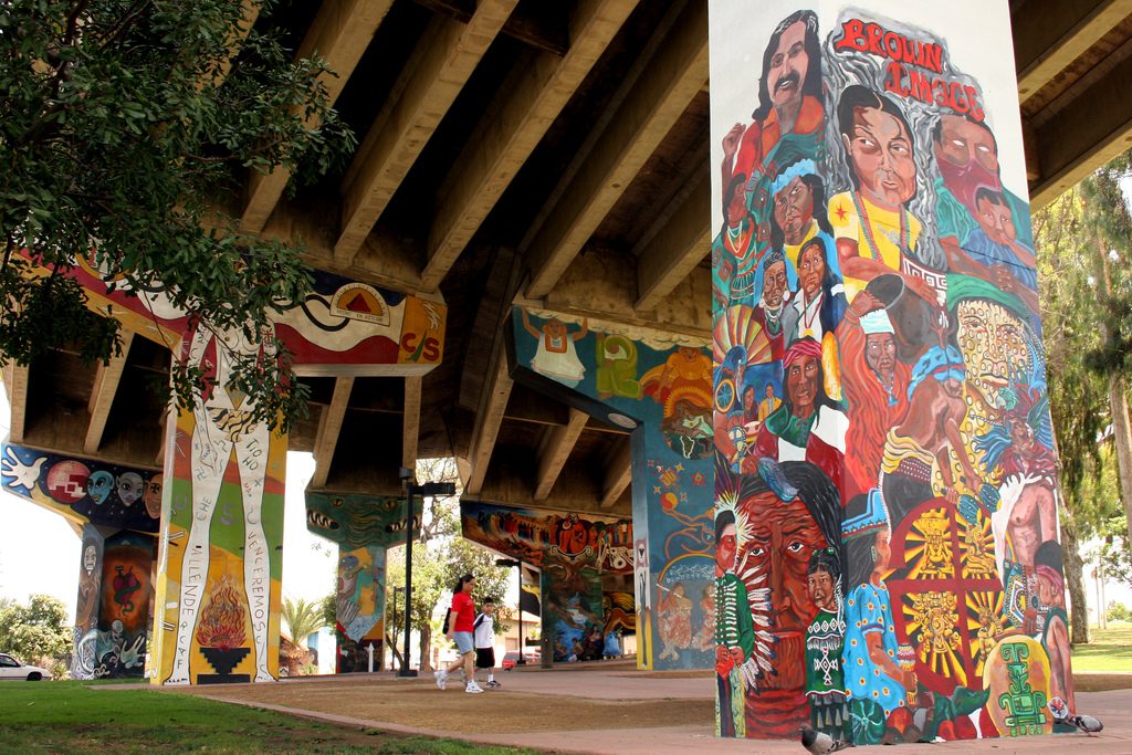 Murals under the highway during the daytime at Chicano Park in Barrio Logan, San Diego.