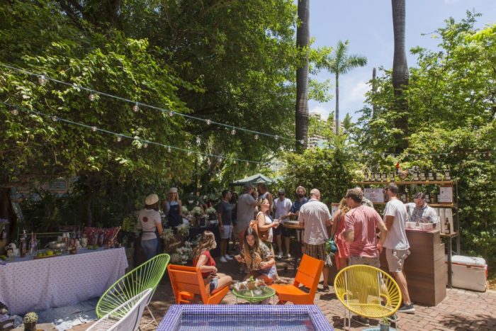 A crowded patio on a clear sunny day at Broken Shaker-Miami, Florida