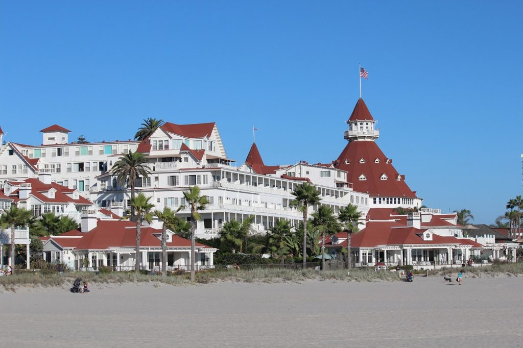 The beach and Hotel Del Coronado on Coronado Island in San Diego. A picturesque spot to relax for daycation relaxation.